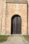 Belgium, Bruges, Staple Bend Tunnel, a bench in front of a brick building with Staple Bend Tunnel in the background