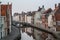 Belgium. Brugge. Old town, canal and historical buildings photo