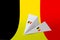 Belgium flag depicted on paper origami airplane. Handmade arts concept