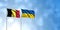 Belgium Flag with Ukraine Flag, with a cloudy sky