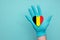 Belgium medical health heart. Nurse hand holding country heart flag