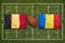 Belgium vs. Romania flags on rugby field