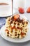 Belgium waffles with strawberries, banana and flowing chocolate