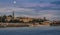 Belgrade buildings and Saborna church across the Sava river with full moon