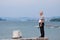 BELGRADE, SERBIA - AUGUST 2, 2015: Old man observing Belgrade center and the Danube from the suburb of Zemun on a cloudy day