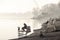 Belgrade, Serbia - January 10, 2020: Silhouettes of  people relaxing at Ada lake bank in off season foggy polluted day