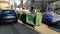 Belgrade, Serbia. January 24, 2020. Garbage containers in the city center. Roadway with cars. Asphalt road with passers-by.