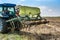 BELICA, CROATIA - Oct 13, 2020: Closeup shot of a tractor plowing hay on a field