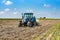 BELICA, CROATIA - Oct 13, 2020: shot of a tractor plowing hay on a field