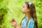 Beliefs about dandelion. Girl making wish and blowing dandelion nature background. Why people wish on dandelions
