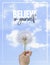 Believe in yourself, Hand holding Dandelion flower pointing to blue sky, close up photography, banner design