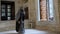 Believer Muslim Woman, Masked muslim woman praying at antic mosque with stone background