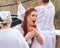 Believers arriving at the Epiphany Rite use Holy Water for ablution from the Jordan River on the Baptismal Site of Jesus Christ