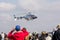 Bell 407 Helicopter display at the 2018 Rand Airshow while spectators watch