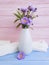 Bell, chrysanthemum vase on a wooden background