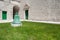 Bell, grass, doors and church