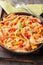 Bell pepper and Creamy Tomato Sauce is a sweet and simple match for chunky ribbon-shaped reginette mafaldine pasta closeup on the