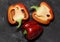 Bell pepper cut into two halves. Whole pepper. Useful vegetables. White seeds, green branch