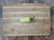 Bell pepper on a wooden surface. Fresh peppers on a cutting board. Bell peppers for salads, soups, pizza and ketchup.