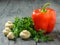 Bell peppers, four mushrooms and parsley on a wooden table. Vegetarian food