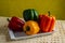 Bell peppers or peppers, of various colors, green, yellow and red, on a white plate, freshly cut, and moistened by rinsing them.