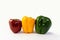 Bell peppers red yellow green staggered in line