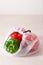 Bell peppers in reusable mesh nylon bag, plastic free zero waste concept