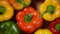 Bell peppers on rotating background. Top view. Vegan and raw food concept. Bright colors vegetables
