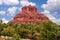 Bell Rock Blue Sky, Fluffy Clouds, and Sun in Sedona, Arizona