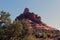 Bell Rock, a red sandstone mountain formation, in the late afternoon on the Courthouse Butte Loop Trail in Sedona