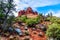 Bell Rock showing Vegetation growing on the Red Rocks and Red Soil in Coconino National Forest near Sedona