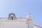 Bell on the roof of an old Portuguese Catholic church