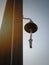 Bell on the ship`s mast against the blue sky