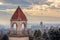 Bell tower against distant views of downtown and Utah State Capital Building