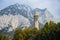 Bell Tower of the Basilica of St Nicholas against beutiful scenery of San Martino mountain, a part of Bergamo Alps