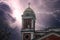 The bell tower at Cathedral-Basilica of the Immaculate Conception with powerful storm clouds and lightning at sunset in Mobile