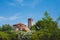 Bell tower of Cathedral of Santa Maria Assunta and Church of Santa Fosca over trees in Torcello, Venice, Italy