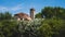 Bell tower of Cathedral of Santa Maria Assunta and Church of Santa Fosca over trees in Torcello, Venice, Italy