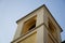 Bell tower of the catholic church against clear blue sky bottom view