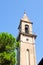 Bell tower of catholic church Chiesa di San Leopoldo in small town Vada on the coast of the Ligurian Sea.