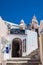 Bell tower of the Catholic Monastery of Dominican Nuns and beautiful alleys at Fira City in