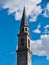 Bell tower church pinzolo Italy against cloudy blue sky