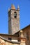 The bell tower of the Church of Santa Maria Assunta in Piazza Roma in Monteriggioni