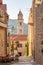 Bell tower of Dominican Monastery view from Dubrovnik old town street in Croatia summer morning