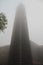 Bell tower in the fog. Sanctuary of Aranzazu