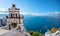 Bell tower of an orthodox church at Santorini, Greece. Honeymoon summer aegean cycladic background.