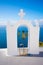 Bell tower of an orthodox church at Santorini, Greece. Honeymoon summer aegean cycladic background.