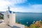 Bell tower of an orthodox church at Santorini, Greece. Honeymoon summer aegean cycladic background.