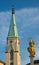 Bell tower of parish church and column with Holy Mary in Celje, Slovenia