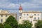 The bell tower of the Saint Spyridon Church and apartments store